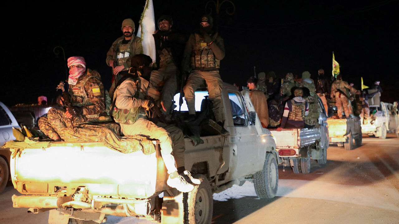 FILE PHOTO: Syrian Democratic Forces vehicles withdraw from the front lines following an agreement between the Syrian government and the Syrian Democratic Forces, in Hasakah, Syria February 10, 2026. REUTERS/Orhan Qereman/File Photo