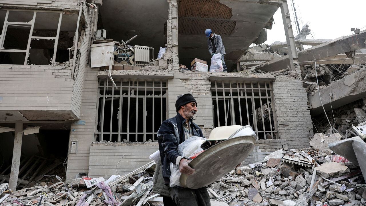 A man walks amid rubble in the aftermath of a strike, amid the U.S.-Israeli conflict with Iran, in Tehran, Iran, March 12, 2026. Majid Asgaripour/WANA (West Asia News Agency) via REUTERS