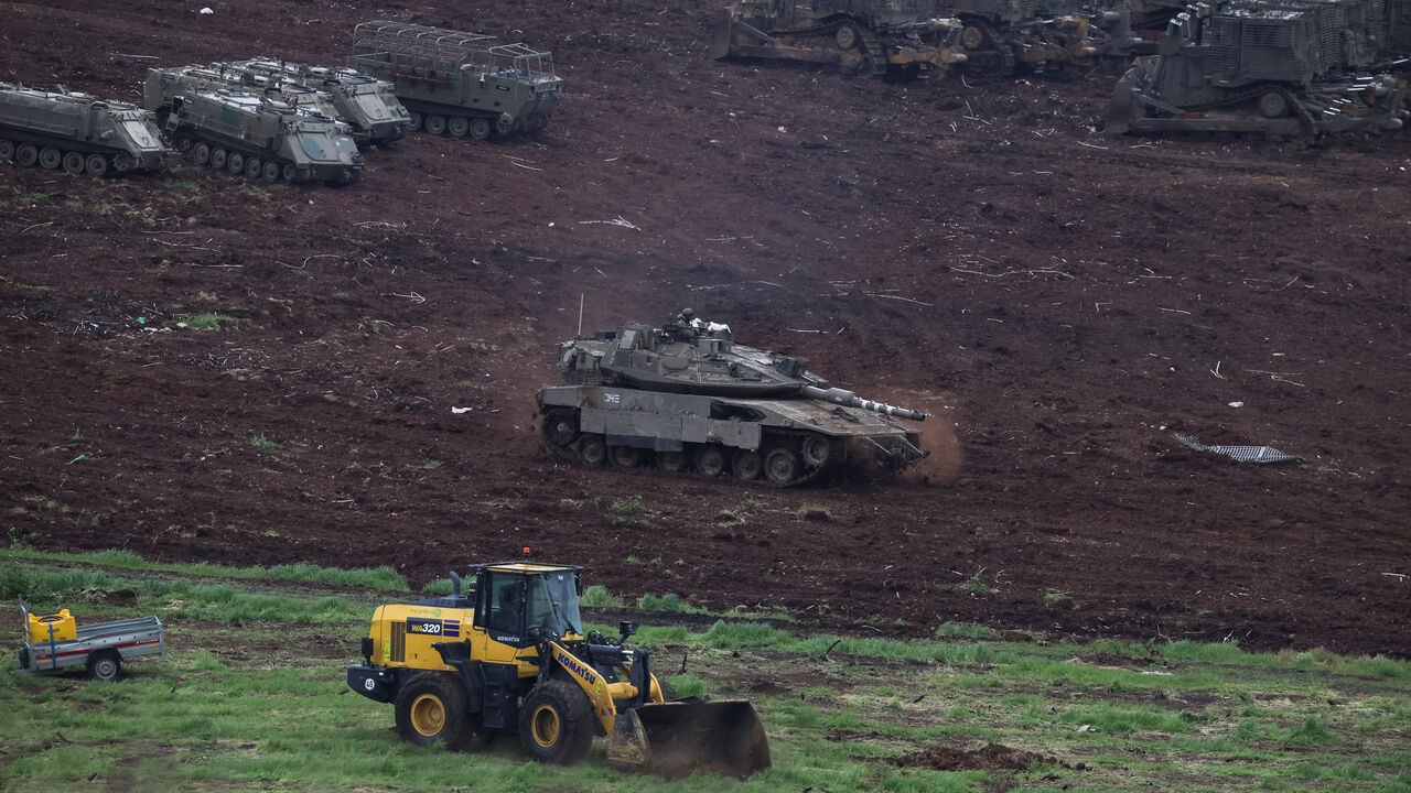 Israeli military vehicles at the Israeli side of the Israel-Lebanon border, amid escalation between Hezbollah and Israel, and amid the U.S.-Israeli conflict with Iran, in northern Israel, March 15, 2026. REUTERS/Shir Torem