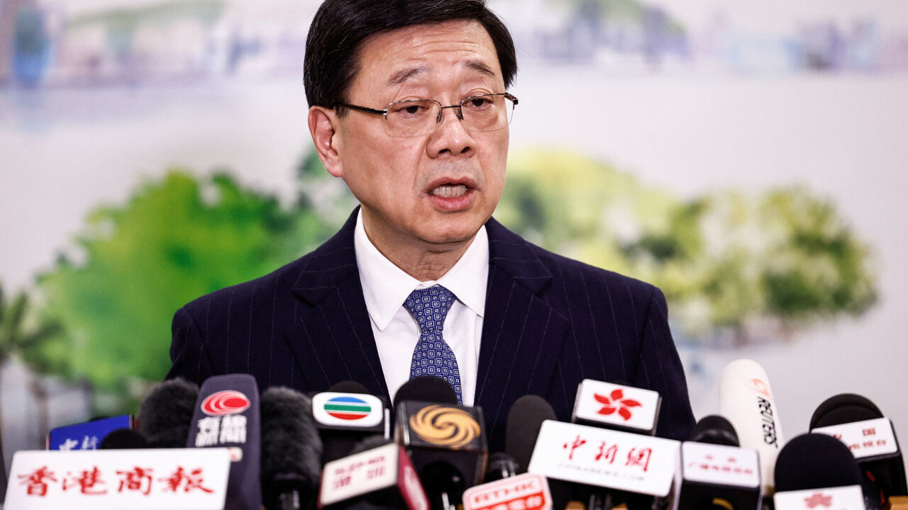 Chief Executive of Hong Kong John Lee speaks during a press conference in Beijing, China December 16, 2025. REUTERS/Tingshu Wang