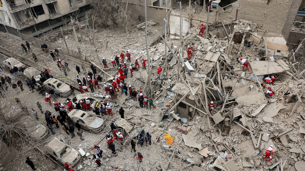 Emergency personnel work at the site of a strike on a residential building, amid the U.S.-Israeli conflict with Iran, in Tehran, Iran, March 16, 2026. Majid Asgaripour/WANA (West Asia News Agency) via REUTERS