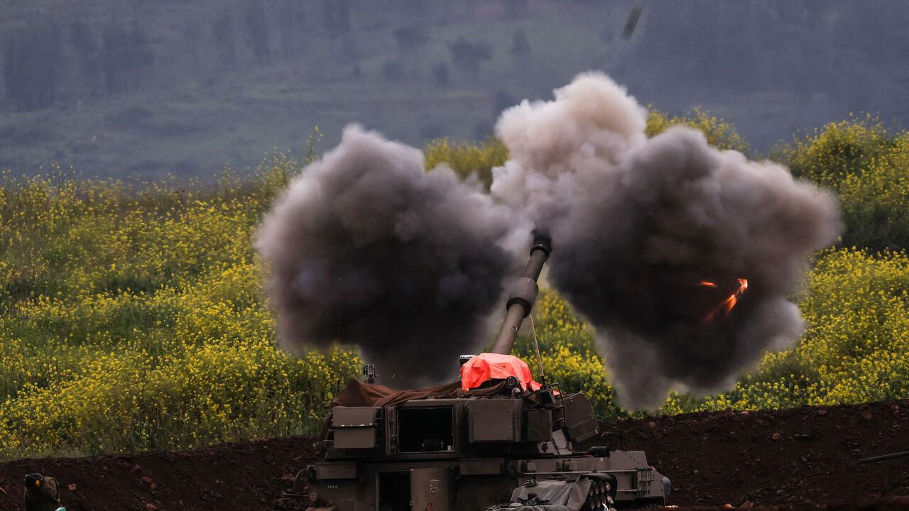 An Israeli artillery unit fires, amid escalation between Hezbollah and Israel, and amid the U.S.-Israeli conflict with Iran, on the Israeli side of the Israel-Lebanon border, March 15, 2026. REUTERS/Shir Torem