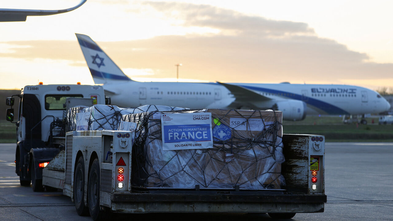 Worldwide Flight Services (WFS) personnel prepare humanitarian aid packages for the first French humanitarian flight to Beirut, carrying 60 tonnes of relief supplies and pharmaceutical products, at Paris‑Charles de Gaulle Airport, in Roissy‑en‑France near Paris, France, March 12, 2026. REUTERS/Gonzalo Fuentes