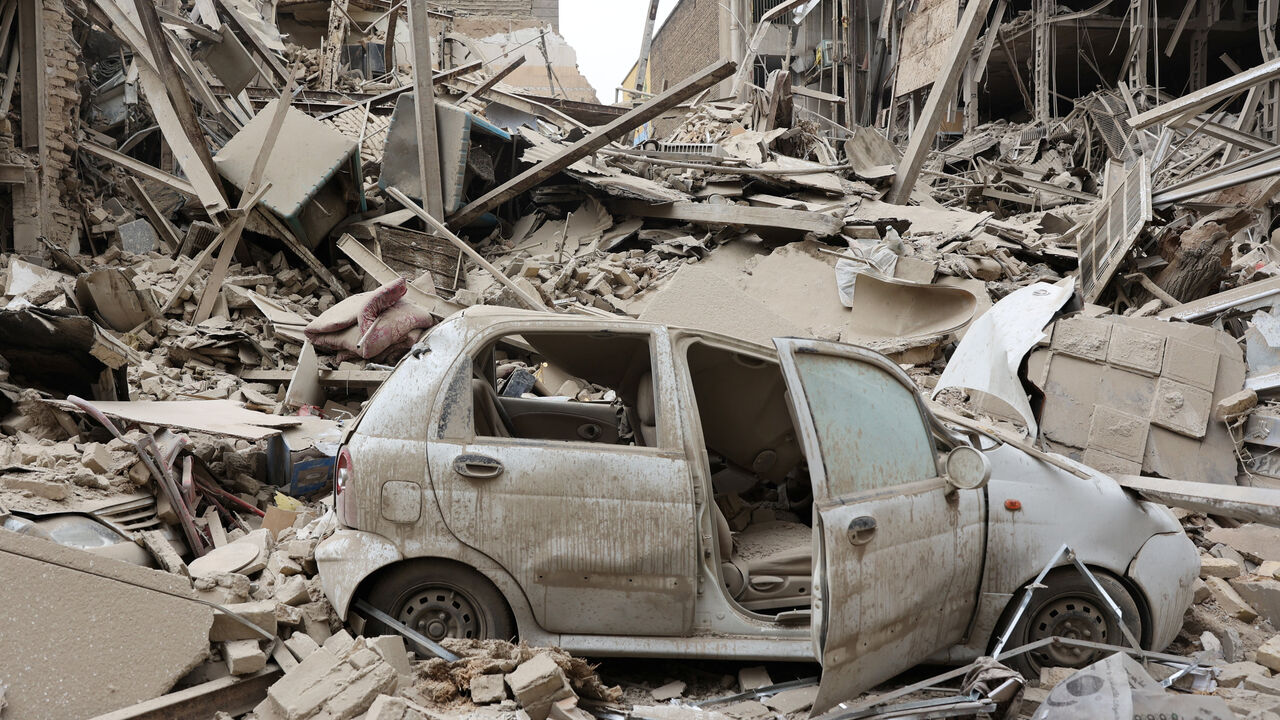 A destroyed vehicle amid rubble at the site of a strike on a residential building, amid the U.S.-Israeli conflict with Iran, in Tehran, Iran, March 16, 2026. Majid Asgaripour/WANA (West Asia News Agency) via REUTERS