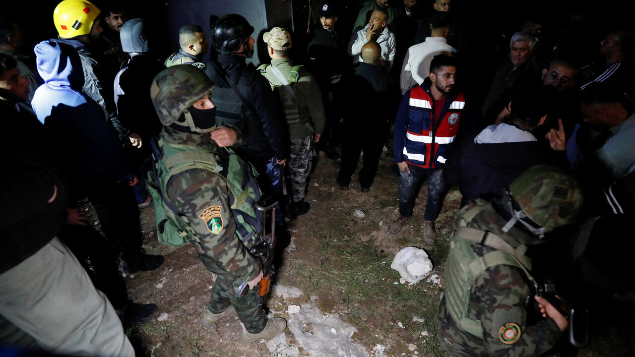 Palestinian security forces gather at the scene where Palestinian women were killed in an Iranian missile attack near Hebron in the Israeli-occupied West Bank March 18, 2026. REUTERS/Yosri Aljamal
