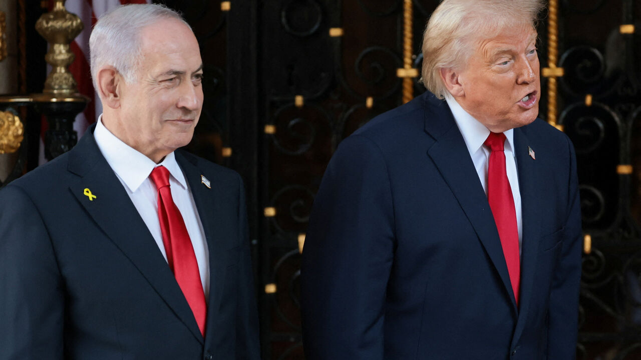 U.S. President Donald Trump speaks next to Israeli Prime Minister Benjamin Netanyahu upon arrival for meetings at Trump's Mar-a-Lago club in Palm Beach, Florida, U.S., December 29, 2025. REUTERS/Jonathan Ernst