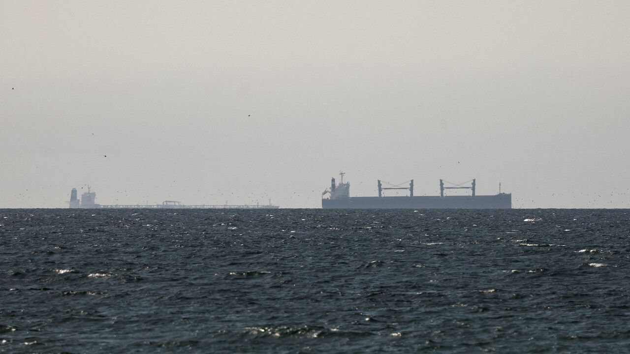 A cargo ship in the Gulf, near the Strait of Hormuz, as seen from northern Ras al-Khaimah, near the border with Oman’s Musandam governance, amid the U.S.-Israeli conflict with Iran, in United Arab Emirates, March 11, 2026. REUTERS/Stringer