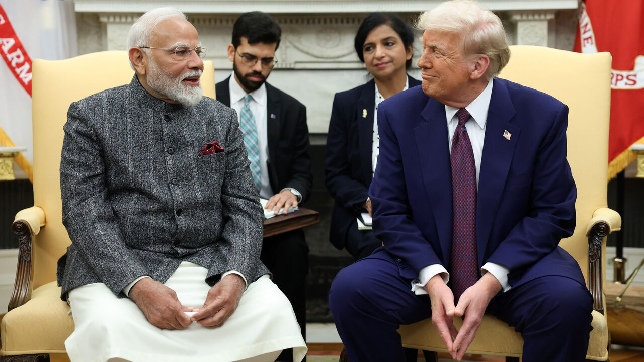 FILE PHOTO: U.S. President Donald Trump meets with Indian Prime Minister Narendra Modi at the White House in Washington, D.C., U.S., February 13, 2025. REUTERS/Kevin Lamarque/File Photo