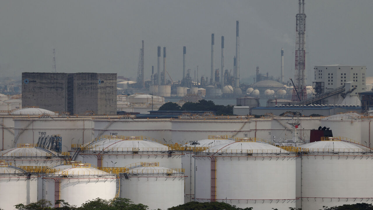 FILE PHOTO: Storage tanks and oil refineries in Jurong Island, Singapore, March 24, 2026. REUTERS/Edgar Su/File Photo
