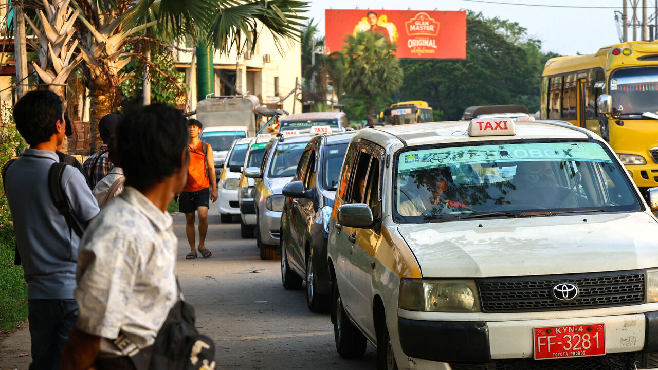 Drivers queue to fill fuel at a gas station amid the U.S.-Israeli war on Iran, in Yangon, Myanmar, March 20, 2026. REUTERS/Stringer