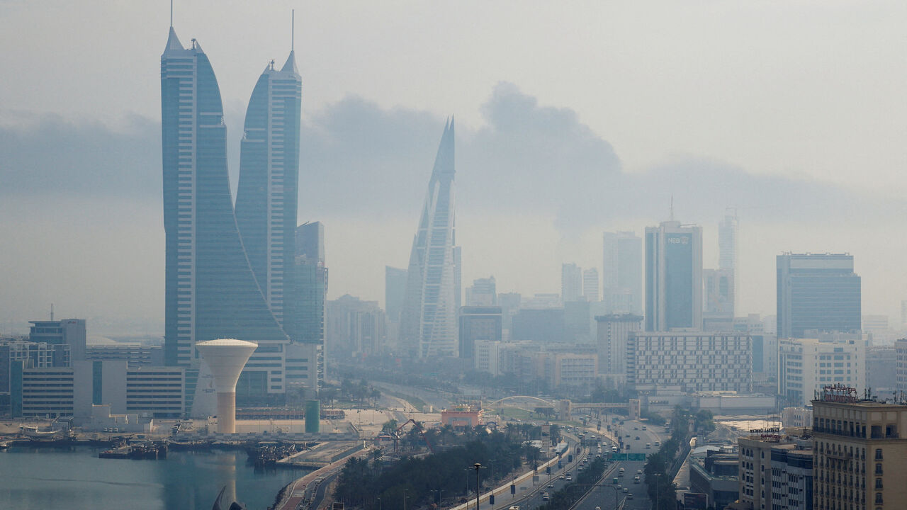 Smoke rises following a reported Iranian drone strike on the fuel storage facility of Bahrain International Airport, amid the U.S.-Israeli conflict with Iran, in Muharraq, Manama, Bahrain, March 12, 2026. REUTERS/Stringer