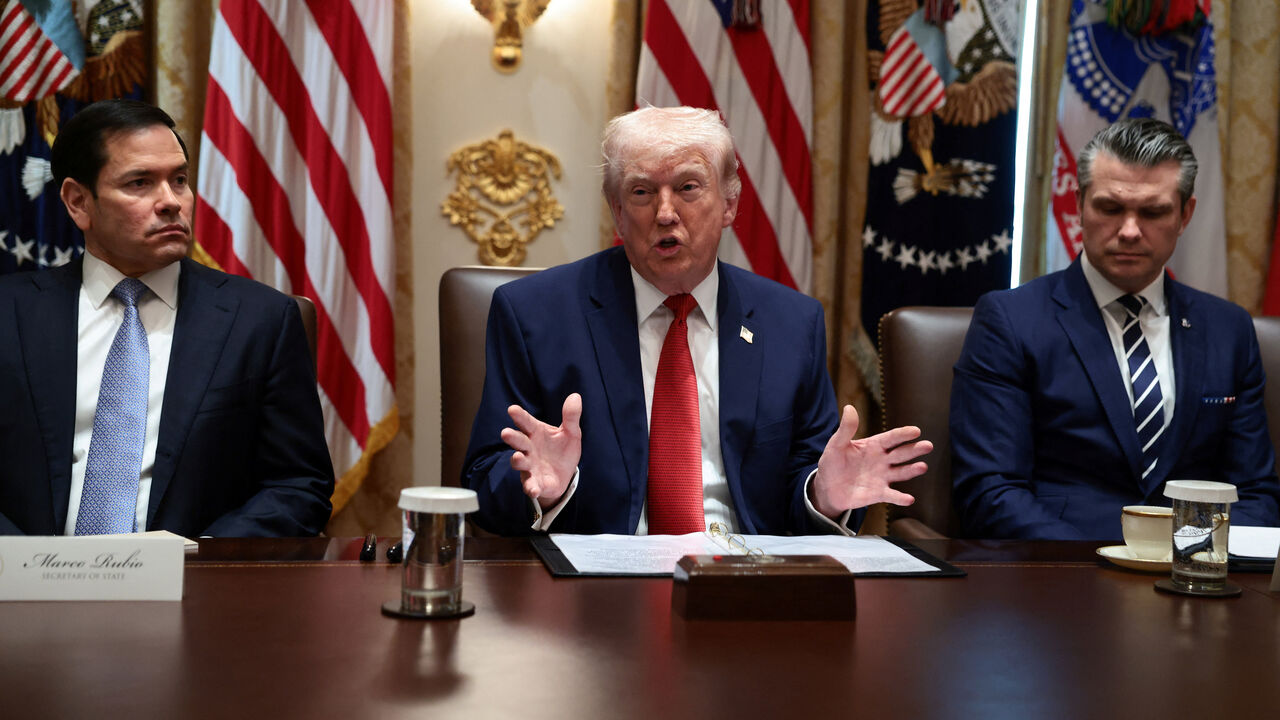 U.S. President Donald Trump, sitting next to Secretary of State Marco Rubio and Defense Secretary Pete Hegseth, speaks during a cabinet meeting at the White House in Washington, D.C., U.S., March 26, 2026. REUTERS/Evelyn Hockstein