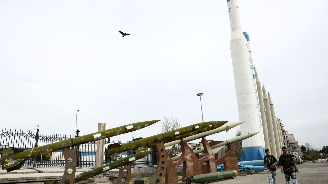 People walk near Iranian missiles in a park, amid the U.S.-Israeli conflict with Iran, in Tehran, Iran, March 26, 2026. Majid Asgaripour/WANA (West Asia News Agency) via REUTERS