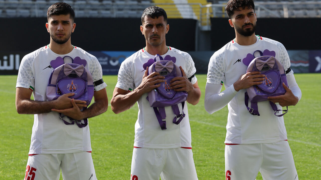 Soccer Football - International Friendly - Iran v Nigeria - Mardan Sports Complex, Antalya, Turkey - March 27, 2026  Iran's Aria Yousefi, Ali Nemati and Mohammad Ghorbani hold school bags in memory of the victims of the girls school bombing in Minab, Iran REUTERS/Umit Bektas