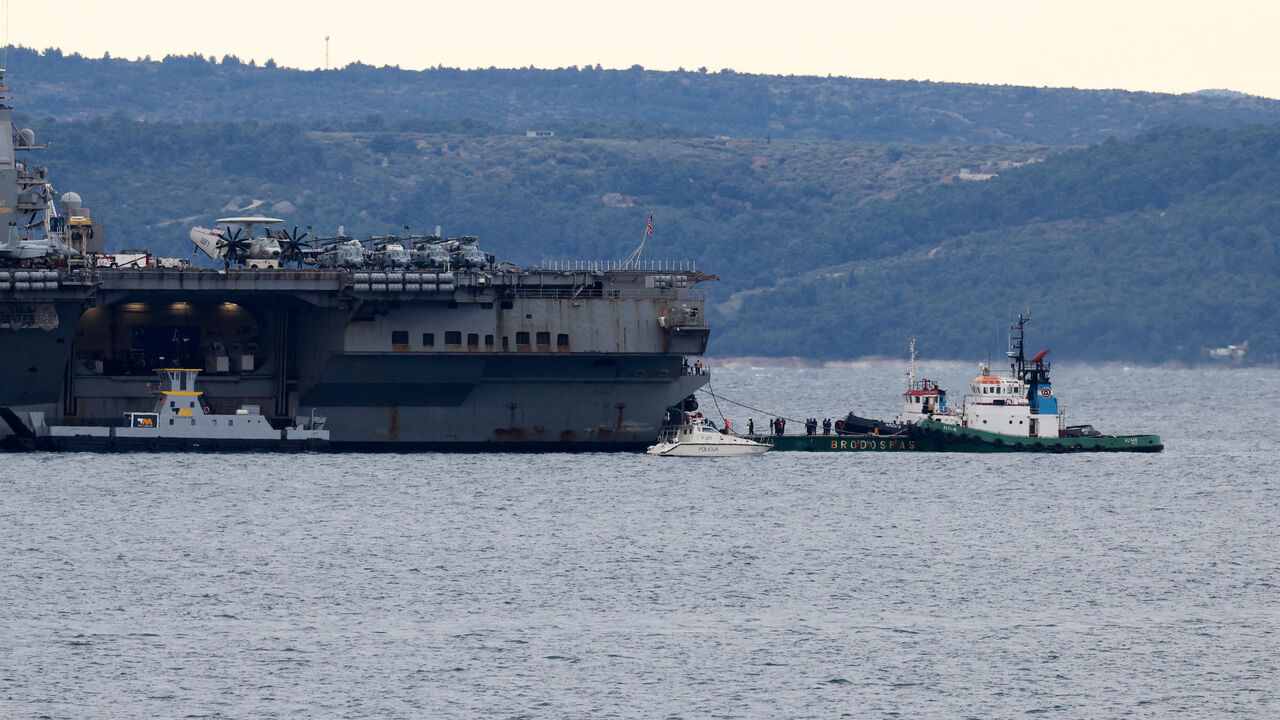 A ship carrying supplies to U.S. aircraft carrier "Gerald R. Ford" arrives as the aircraft carrier holds position in front of Split, in the Adriatic Sea, March 28, 2026. REUTERS/Antonio Bronic