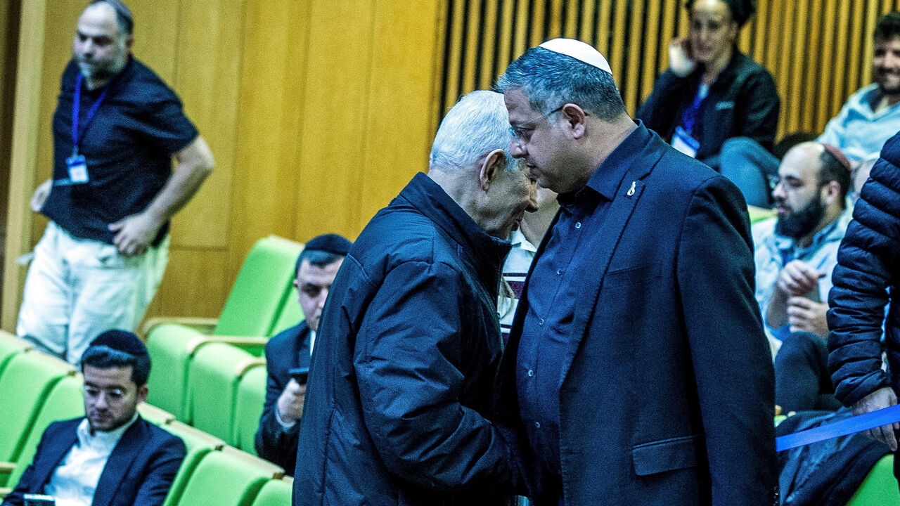 Israeli Prime Minister Benjamin Netanyahu and Israel's far-right National Security Minister Itamar Ben-Gvir shake hands as they attend a session at the Knesset, Israeli parliament, in Jerusalem March 29, 2026 REUTERS/Oren Ben Hakoon