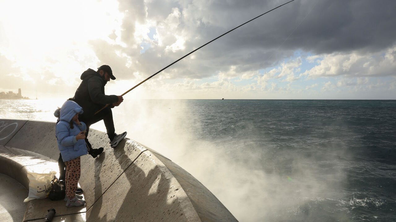 A man fishes at Beirut's corniche, amid escalating hostilities between Israel and Hezbollah, as the U.S.-Israel conflict with Iran continues, in Beirut, Lebanon, March 30, 2026. REUTERS/Raghed Waked