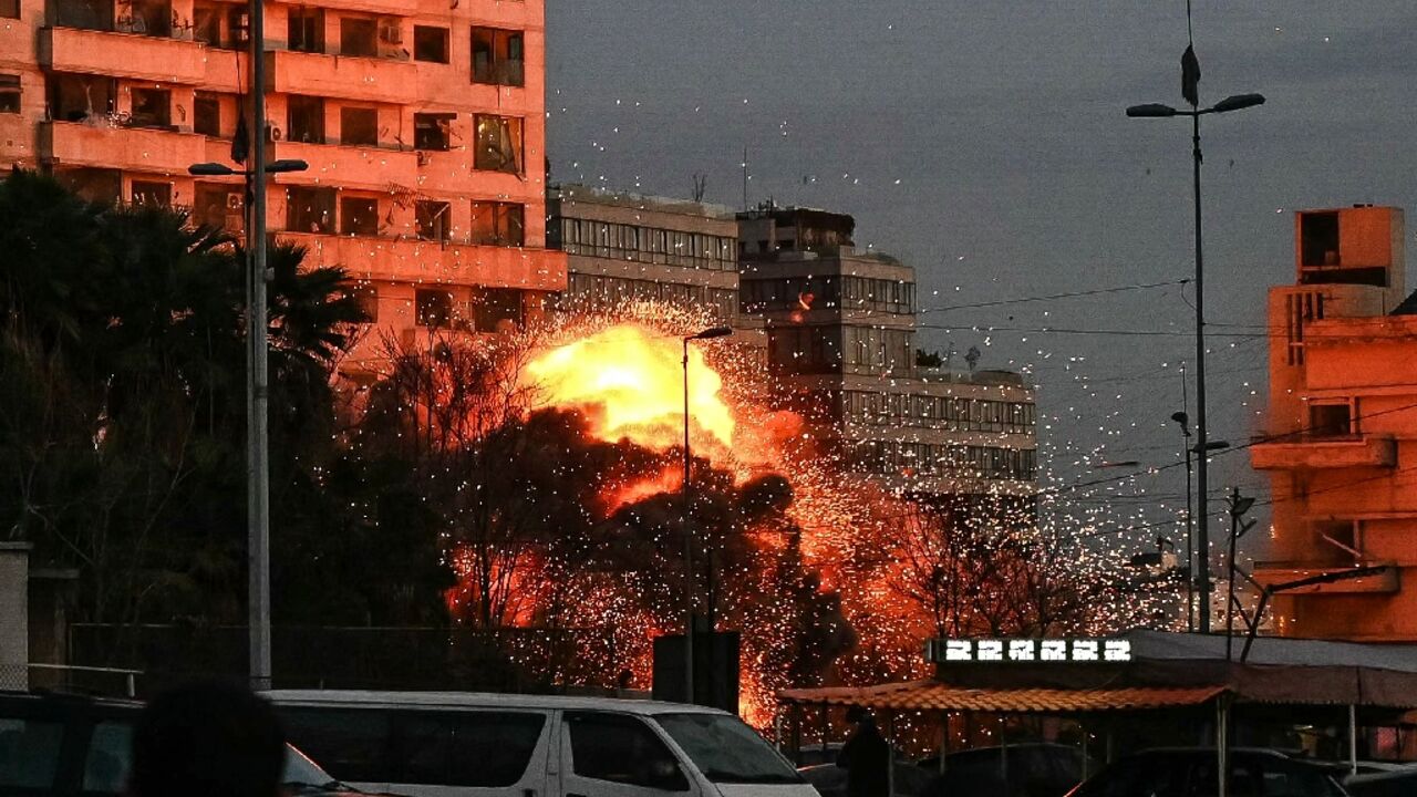 A fireball rises from the site of an Israeli air strike that targeted a building in Beirut
