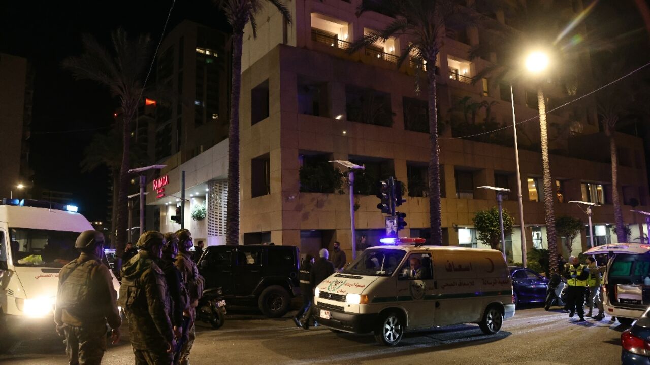 First aid responders gather at a Ramada hotel that Lebanon said was targeted by an Israeli strike, in Beirut's seaside Rawche area, on March 8, 2026