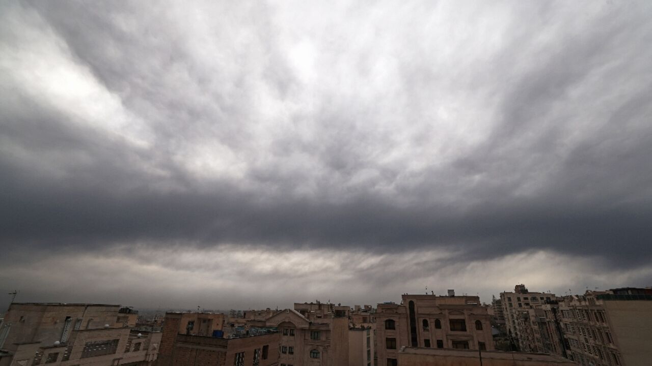 Cloud and smoke lay heavy over Tehran on Sunday after overnight US-Israeli strikes on fuel depots