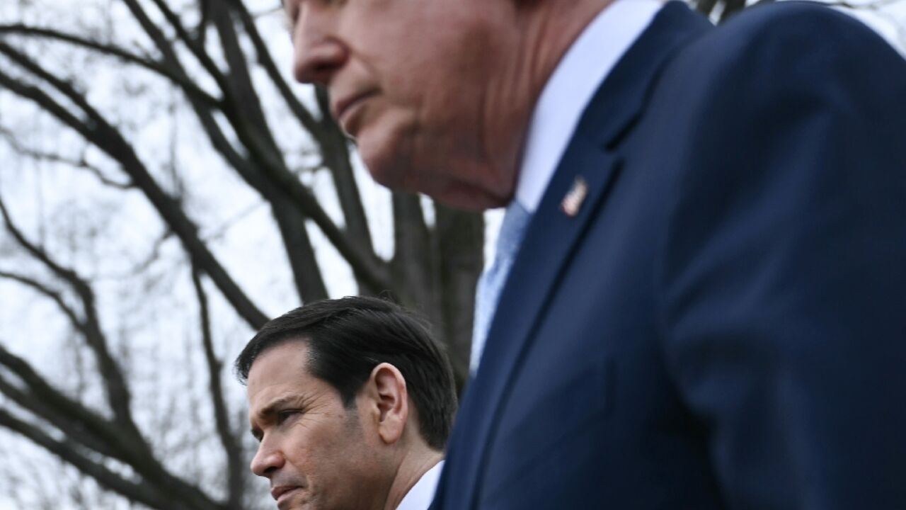 US President Donald Trump walks with US Secretary of State Marco Rubio as he departs from the South Lawn of the White House 