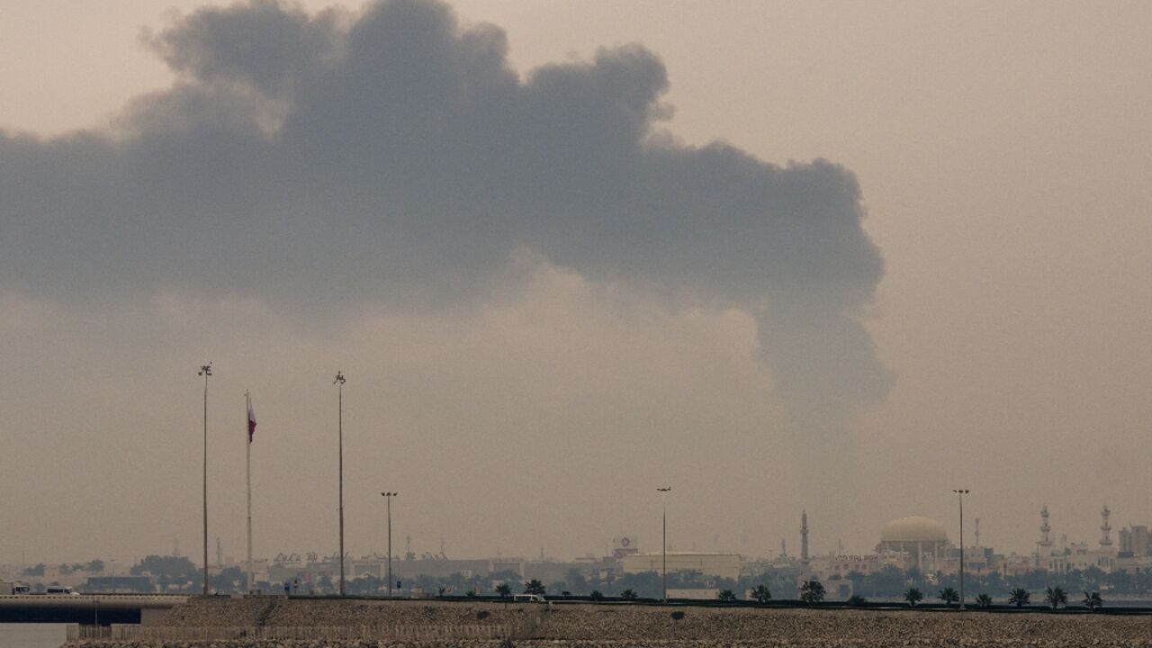 A plume of smoke rises after a reported Iranian strike on fuel tanks in Bahrain