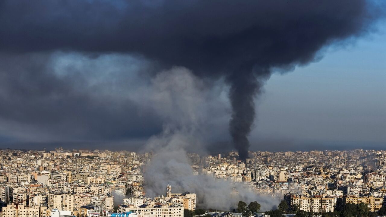 Plumes of smoke rise from the sites of Israeli airstrikes on the southern suburbs of Beirut