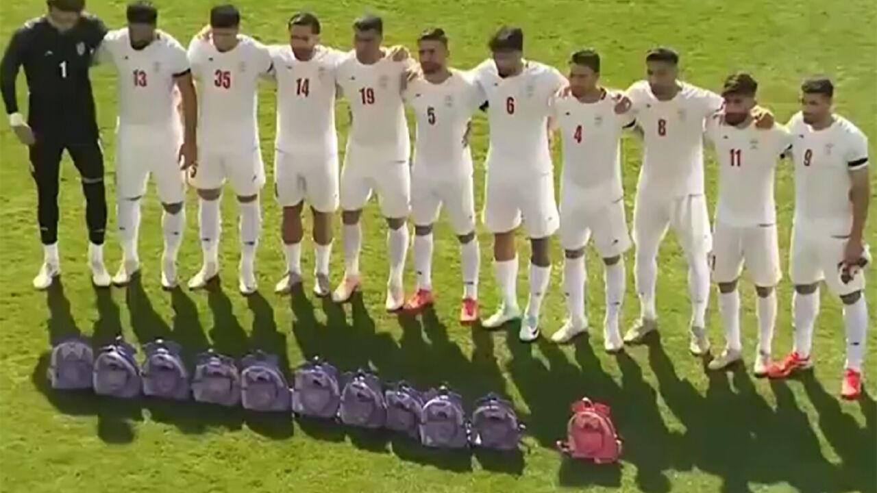 This video grab taken from images released by the Iranian state broadcaster (IRIB) on March 27, 2026 and released via AFPTV, shows the country's football national team paying tribute to the victims of the February 28 strike on an elementary school in Minab, ahead of their friendly football match with Nigeria in Turkey's Antalya