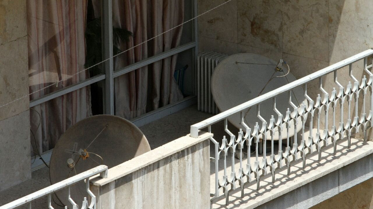 Satellite dishes on a balcony in Tehran. The authorities have often cracked down on their use