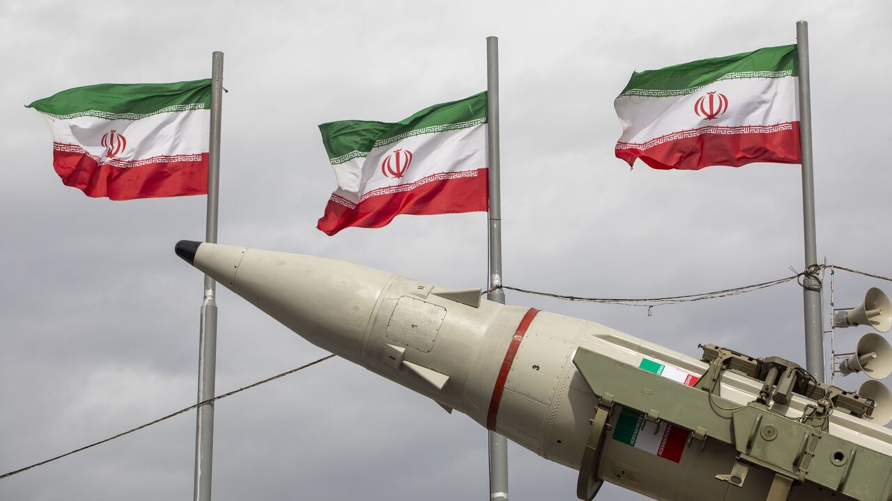 Missiles produced by Iran's armed forces are displayed near a row of Iranian flags during commemorations to mark the anniversary of the 1979 Iranian Revolution on February 11, 2026, in Tehran, Iran. 