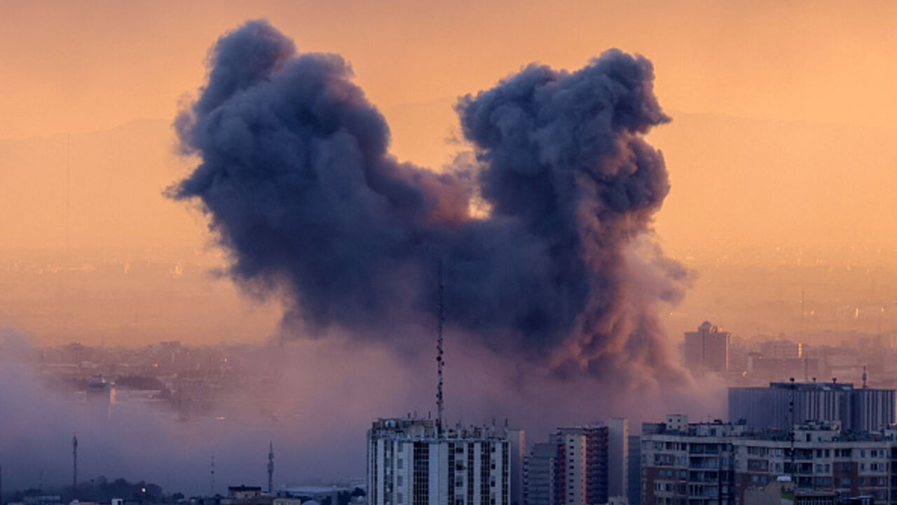 A plume of smoke rises after a strike on the Iranian capital Tehran, on March 3, 2026. (ATTA KENARE / AFP via Getty Images)