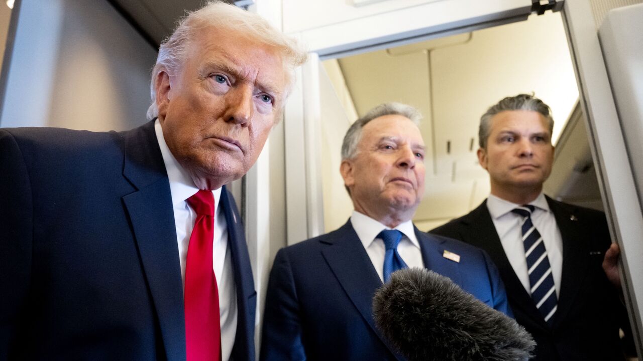 US President Donald Trump speaks with the media as Defense Secretary Pete Hegseth (R) and special envoy Steve Witkoff (C) look on aboard Air Force One during a flight from Dover, Delaware, to Miami, Florida, on March 7, 2026. 