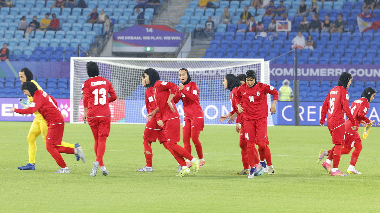 This photo taken on March 8, 2026 shows Iranian players running towards their positions at the start of the AFC Women's Asian Cup Australia 2026 football match between Iran and the Philippines on the Gold Coast. 