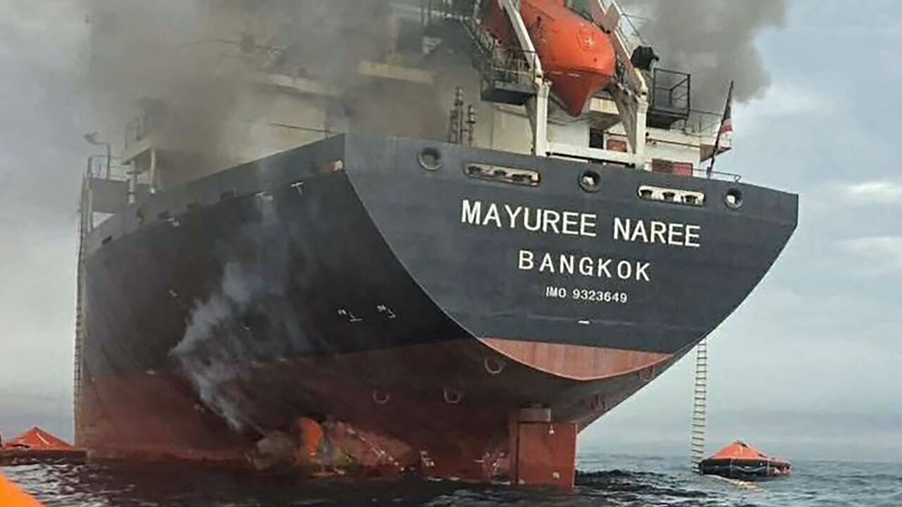 This handout photo taken on March 11, 2026 and released by the Royal Thai Navy shows smoke rising from the Thai bulk carrier 'Mayuree Naree' near the Strait of Hormuz after an attack. 