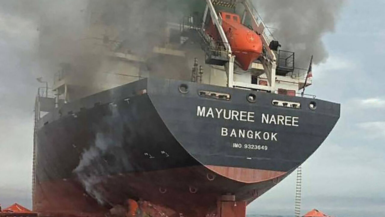 This handout photo taken on March 11, 2026 and released by the Royal Thai Navy shows smoke rising from the Thai bulk carrier 'Mayuree Naree' near the Strait of Hormuz after an attack. 