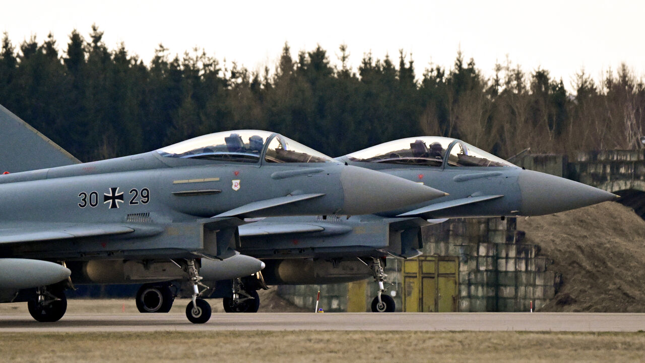 Two Typhoon Eurofighter jets of the Quick Reaction Alert (QRA) of the German air force (Luftwaffe) take off for training during a media day at the military Laage Air Base, northeastern Germany, on March 11, 2026. 
