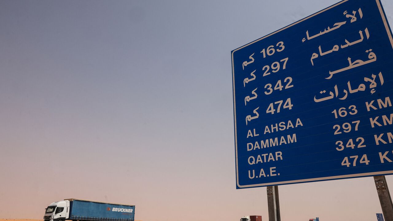Lorries roll along the highway between Riyadh and al-Ahsa, some 200 kilometers east of the Saudi capital, on March 15, 2026. The war sparked by US-Israel strikes on Iran on February 28 has sparked chaos on global markets, and sent the price of oil soaring after the Islamic republic imposed control by force over the crucial artery. (Photo by Fayez NURELDINE / AFP via Getty Images) /