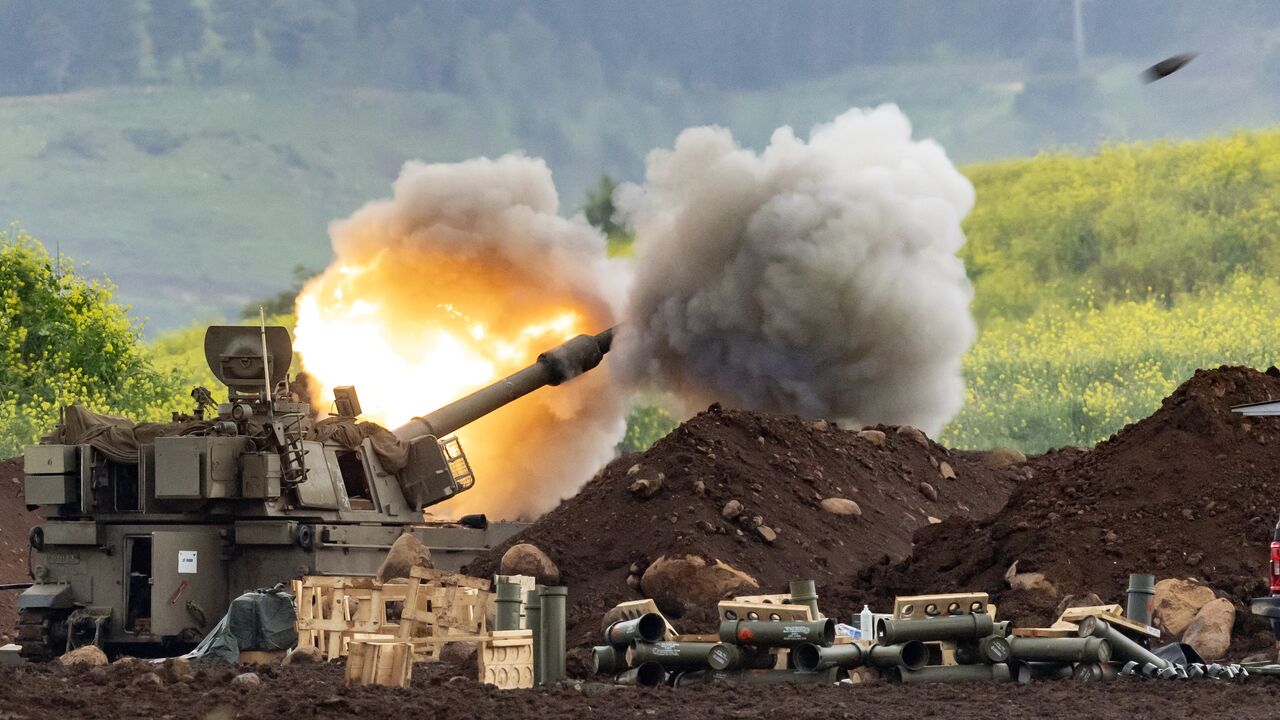 An Israeli self-propelled howitzer artillery gun fires rounds toward southern Lebanon from a position in the upper Galilee in northern Israel near the border on March 15, 2026.