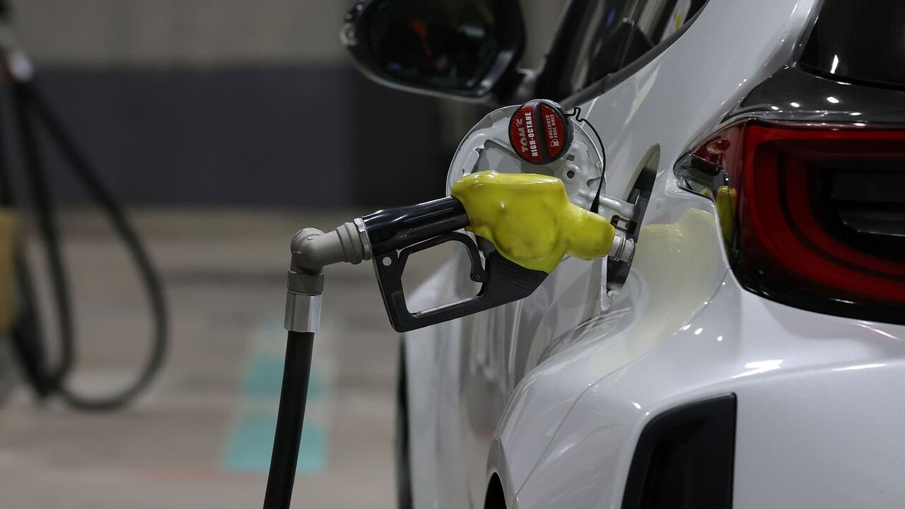 A fuel pump is seen while refuelling a car at a gas station on March 13, 2026 in Kobe, Japan. Japan will release oil reserves to address the rise in gasoline and other petroleum products prices starting next Monday, said Prime Minister Takaichi Sanae. The International Energy Agency (IEA) stated that its member countries agreed to release the largest volume of emergency oil reserves in its history, responding to the disruption in energy markets caused by the Middle East War. (Photo by Buddhika Weerasinghe/G