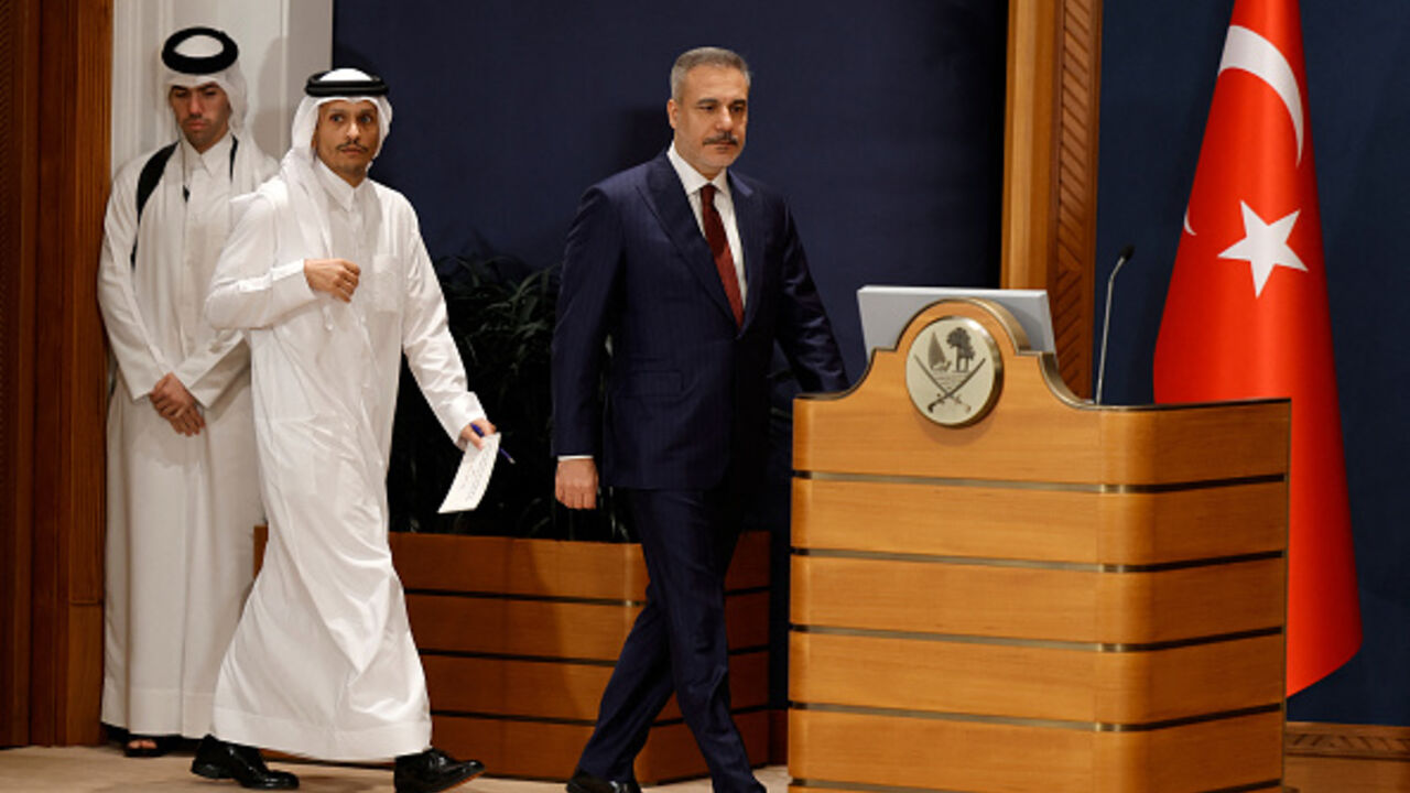 Turkey's Foreign Minister Hakan Fidan (R) and Qatar's Prime Minister and Foreign Minister Sheikh Mohammed bin Abdulrahman Al Thani (2L) arrive to address a joint press conference in Doha on March 19, 2026. (Photo by Karim JAAFAR / AFP via Getty Images)