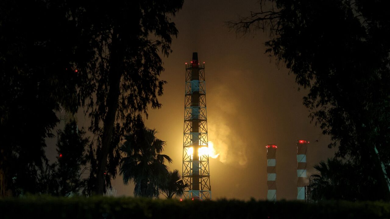 Excess gas is burned at the oil refinery in Israel's northern city of Haifa late on March 19, 2026. 