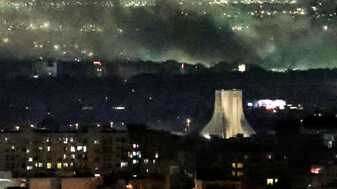 Smoke billows from the site of airstrikes near Azadi Tower in western Tehran on March 10, 2026