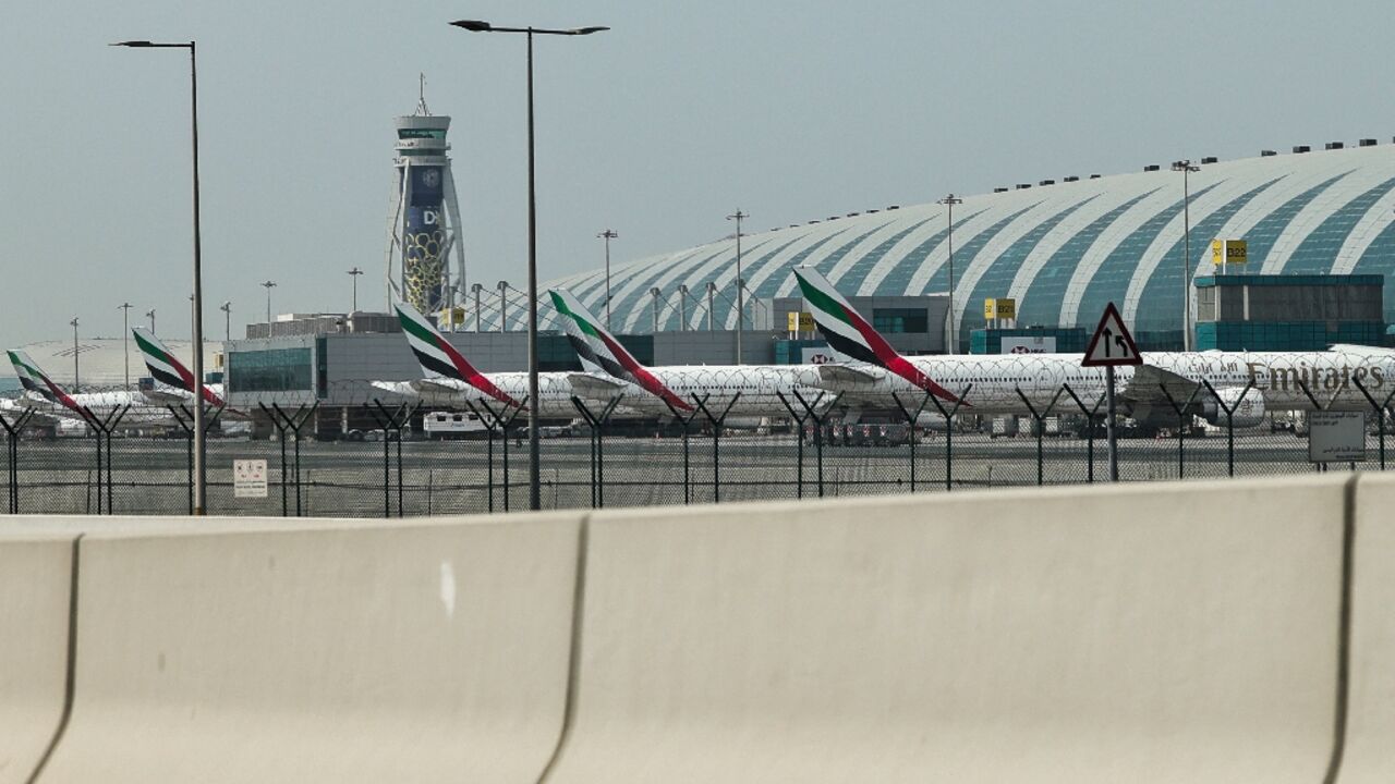 Emirates airline planes are parked on the tarmac at Dubai International Airport on March 2