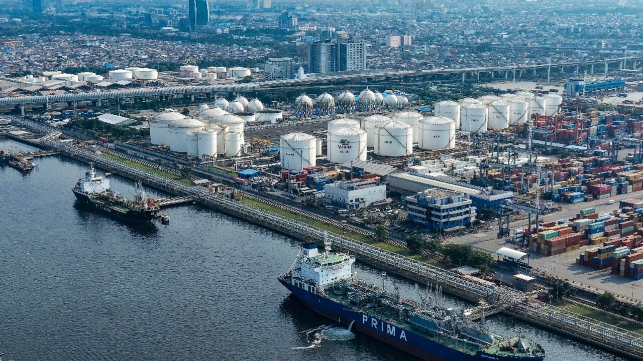 Tankers and cargo ships at the oil depot and container terminal of the Tanjung Priok Port in Jakarta