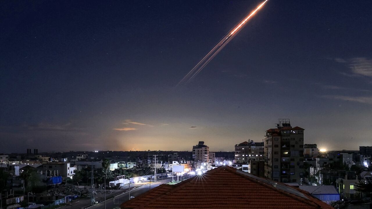 A missile launched from Iran is seen from the central Gaza Strip. Gazans say that since the war with Iran broke out, attention has shifted away from their plight