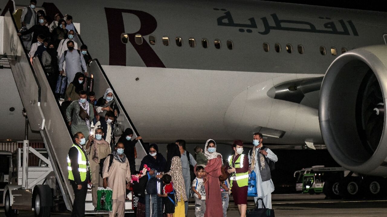 After the US withdrawal in 2021, evacuees from Afghanistan fled to escape the Taliban, seen here landing at Hamad International Airport in Qatar's capital Doha from Kabul 