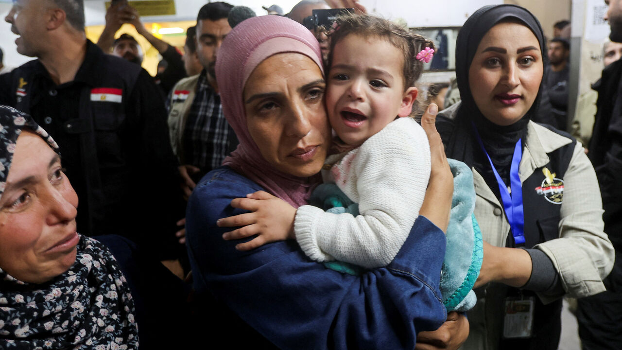Family members reunite with a child who was evacuated from Gaza as a premature baby during the two-year Israeli offensive, and has returned after receiving medical treatment in Egypt, at Nasser Hospital in Khan Younis in the southern Gaza Strip, March 30, 2026. REUTERS/Ramadan Abed