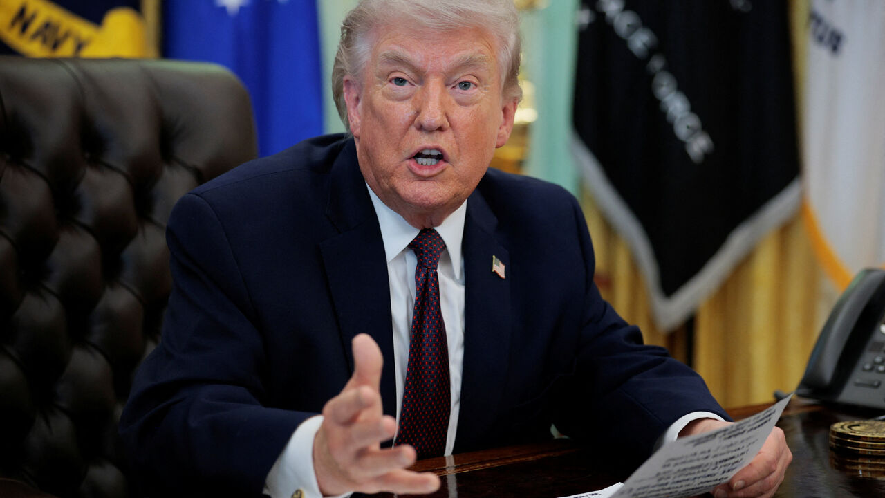U.S. President Donald Trump speaks during the signing ceremony for an execituve order on mail ballots, in the Oval Office of the White House in Washington, D.C., March 31, 2026.  REUTERS/Evan Vucci
