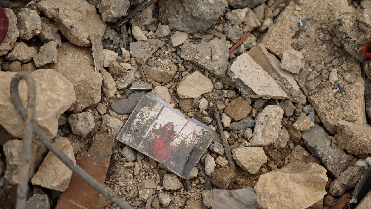A photo lying among the rubble of a house destroyed by an Israeli strike, amid escalating hostilities between Israel and Hezbollah, as the U.S.-Israel conflict with Iran continues, in Houmine El Tahta, Lebanon, April 1, 2026. REUTERS/Yara Nardi     TPX IMAGES OF THE DAY