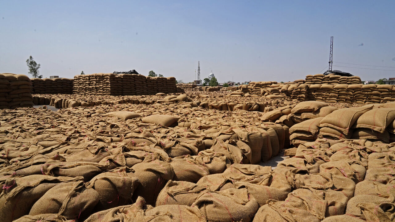Sacks of harvested wheat are seen at a grain market in Gaggarpur village, in the northern state of Haryana, India, April 25, 2025. REUTERS/Bhawika Chhabra